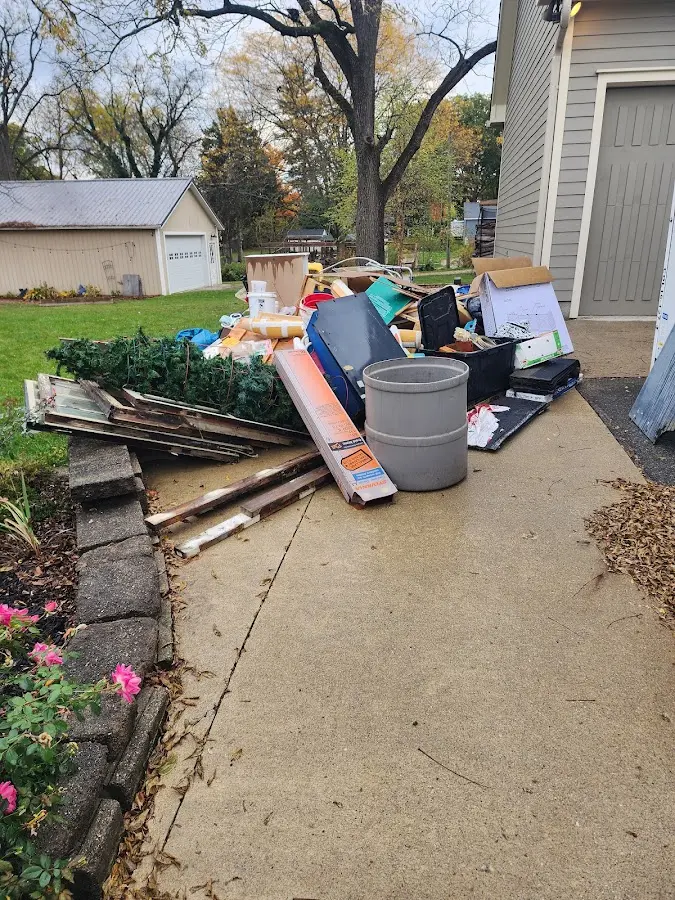 Dumpster being loaded with debris for Demolition Dumpster Rental in Bonadelle Ranchos